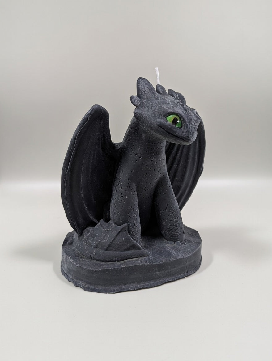 Dragon-shaped candle on a white background