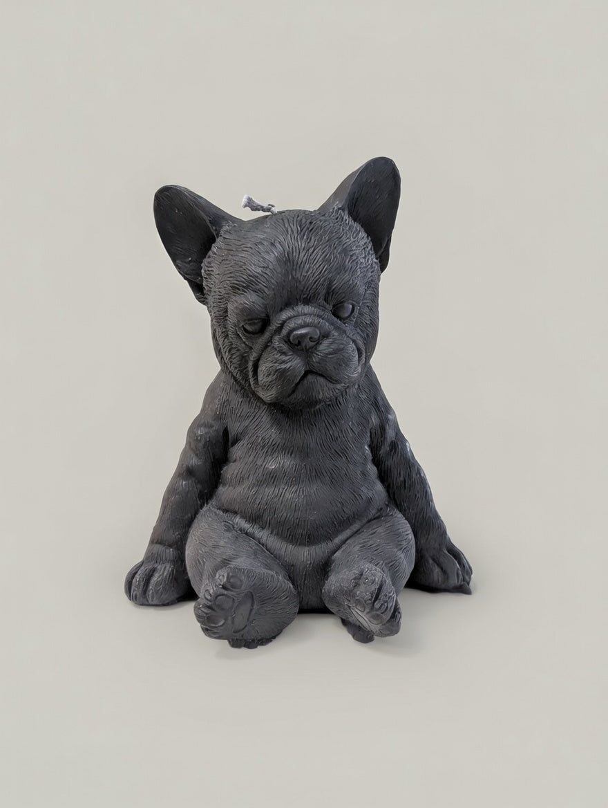 Black French Bulldog candle on a light gray background