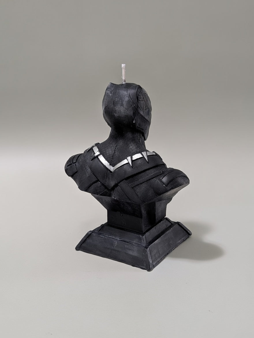 Black bust sculpture on a gray background