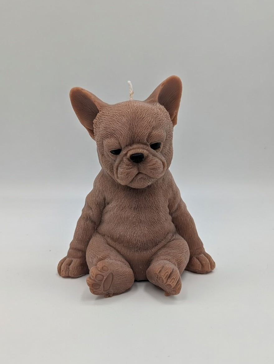 Brown plush French Bulldog candle on a light grey background