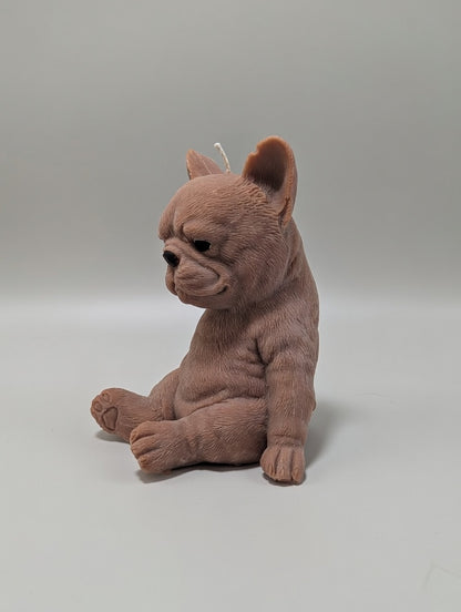 Brown plush French Bulldog candle on a light grey background