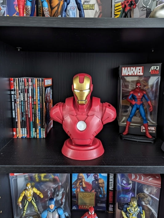 Marvel Iron Man bust on a shelf with action figures and comic books