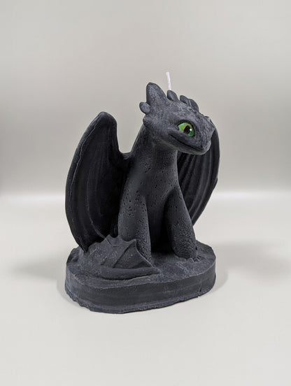 Dragon-shaped candle on a white background